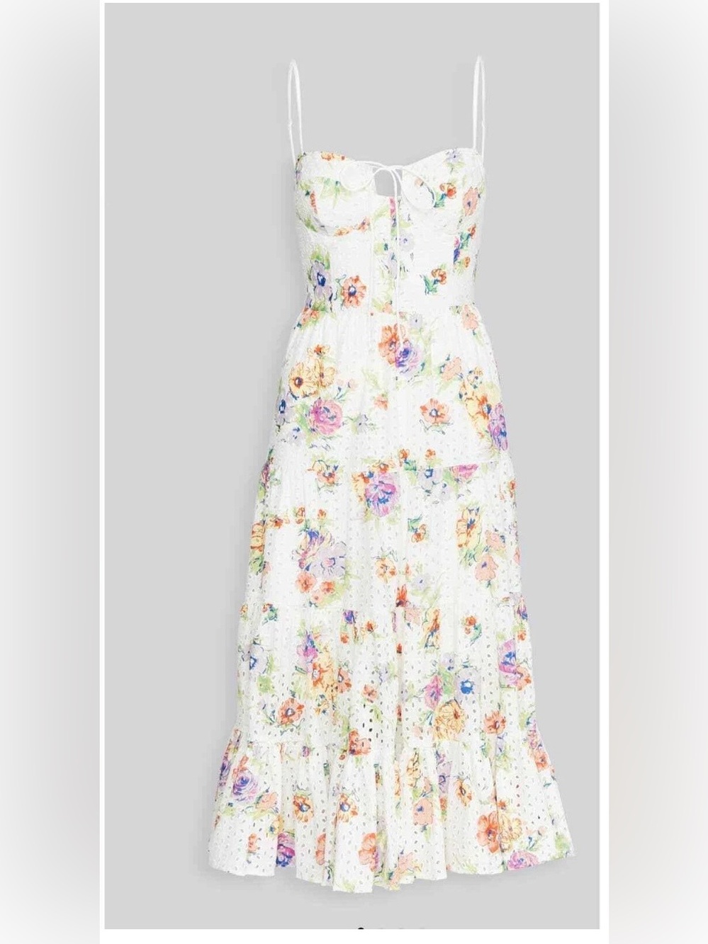 WAYF white midi dress with a colorful floral pattern and tiered skirt.